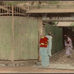 Women bowing to each other in entryway